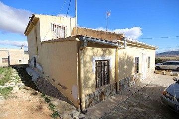 Village House in Casas del Señor with a courtyard and outside kitchen